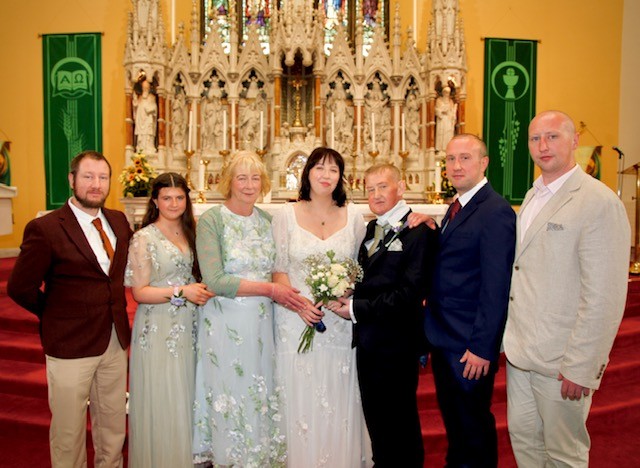 The Sharkey family together on a family wedding day.