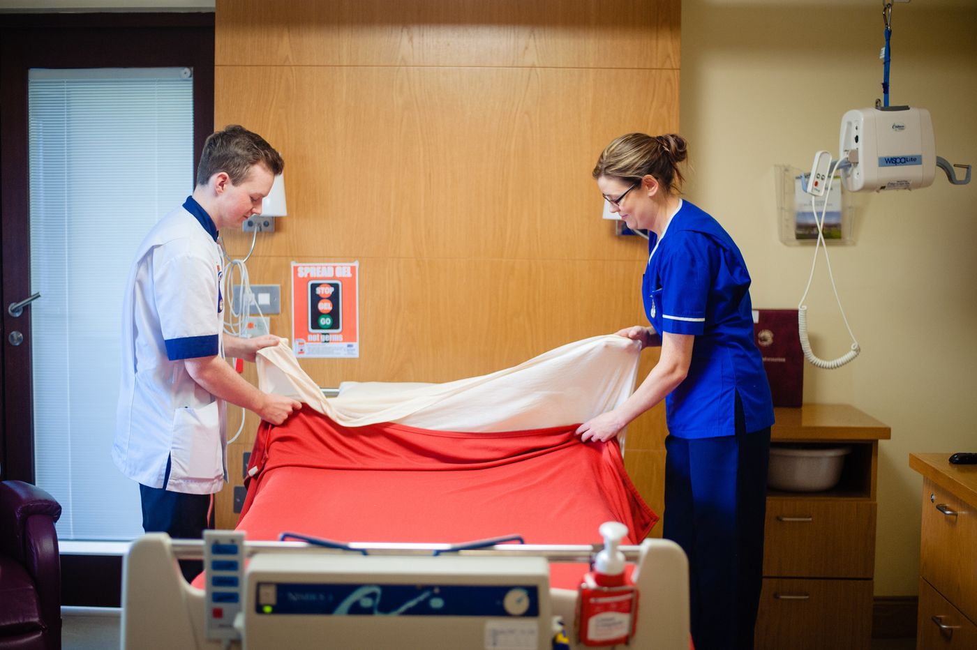 A member of the team preparing an Inpatient Unit room